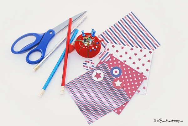 步骤1：准备材料：卡纸、图钉或别针、铅笔/细木棒、胶水