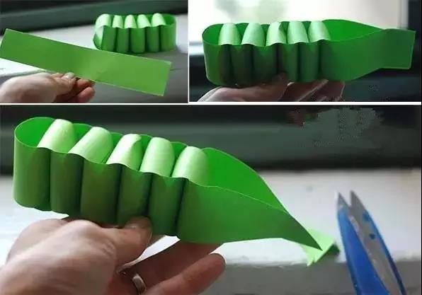 步骤5：把 10 个短纸条交叉缠在一起粘牢，做成鳄鱼的身体，最后一张纸条修剪成尖头