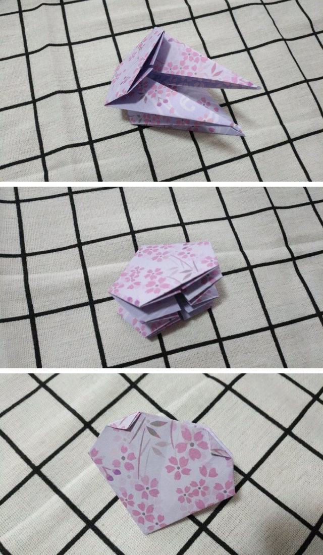 步骤5：然后把刚才对折的横向折痕，把纸张沿着横向折痕往里对折，也就是内折，然后再按之前的步骤折好，下图是一个角内折的样子，然后同样的方法，把其他3个角也沿着横向折痕内折，最后总共是4个角全部对折到里面的样子。