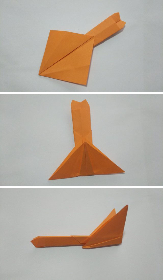 步骤5：好了，前面的折好了之后，然后再把纸张翻到反面，把下面的正方形往上对折，然后纸张左右对折在一起。