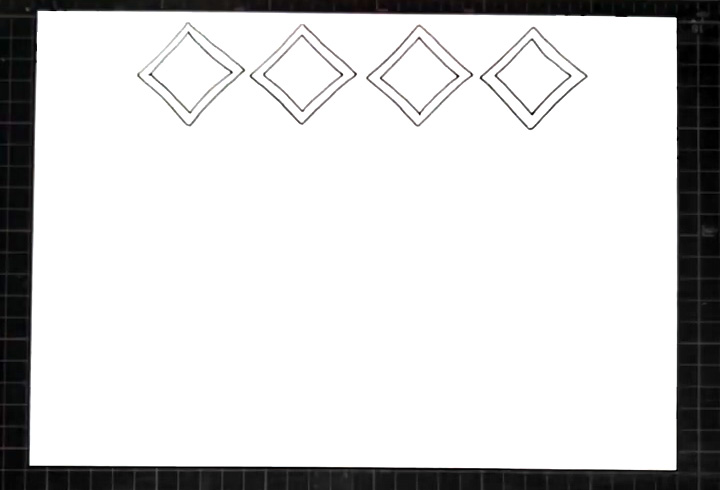 步骤1：顶部画出四个菱形，作为手抄报的标题框。