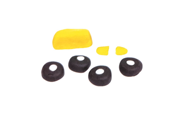 步骤3：用黄泥、白泥和黑泥捏出车灯和车轮。