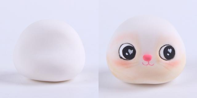 步骤3：开始做小兔子，用白色粘土做出小兔子的头，粉红色粘土做鼻子，黑色粘土做眼睛，用笔装饰好眼睛，然后画出嘴巴和腮红。