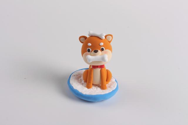 步骤12：把柴犬放在做好的小窝里。