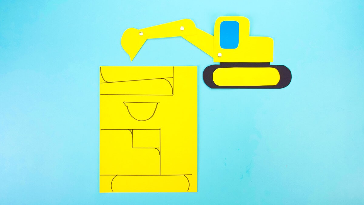 步骤5：制作动臂、手臂和铲斗(动臂是连接到挖掘机驾驶室的倾斜臂。手臂连接到动臂上，可以上下移动。水桶在手臂的末端，就像一把大铲子。那就是挖掘机的特殊挖掘部分!要制作吊臂和手臂，请绘制两个一端较小的矩形。我们的大约 1.5 英寸乘 5 英寸。要制作水桶，请绘制一个适合其中一个矩形小端的水桶形状。在另一张施工纸上，画一个矩形为您的驾驶室制作一个窗户。我们使用蓝纸，我们的窗户大约 2 英寸乘 2.5 英寸。)