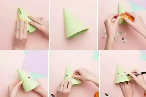 步骤1：我们制作帽子的主体，其实就是将卡纸卷曲成一个椎体就可以了。